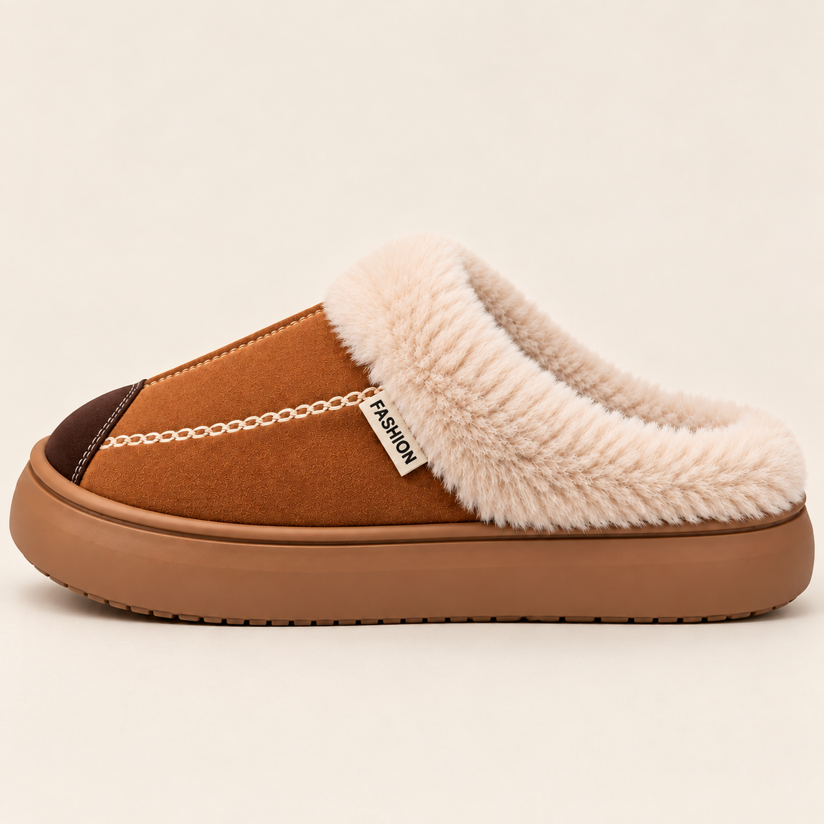 A single slip-on mule slipper shown in profile against a light beige background. The slipper features a tan suede-like upper, a thick cream-colored faux fur collar, a dark brown toe cap, and a matching tan rubber sole.