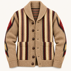 A beige knit cardigan sweater with a shawl collar, dark brown buttons, and a Southwestern pattern featuring vertical stripes and geometric motifs in beige, brown, red, and black.