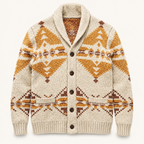 A cream-colored knit cardigan sweater with a brown and ochre orange geometric pattern, featuring a shawl collar, dark brown buttons, and a ribbed hem and cuffs, shown flat on a light off-white background.